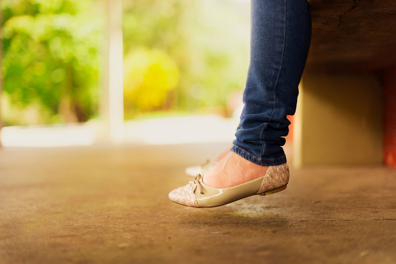Feet in comfortable beige flats