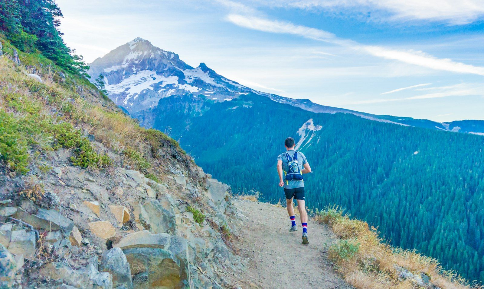 Trail runner on a mountain ridge trail